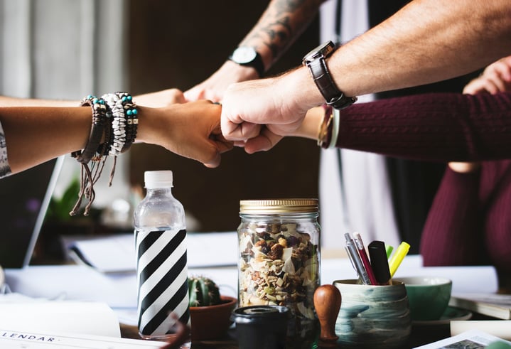 Image of 5-person fist-bump