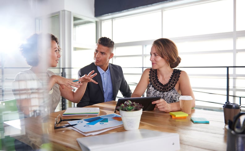 team of successful business people having a meeting in executive sunlit office-3